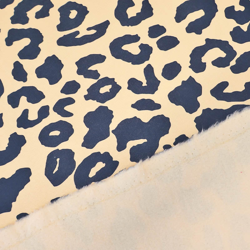 82% Organic Cotton 18% Recycled Polyester Cream Sweatshirt fabric with navy blue Leopard Print