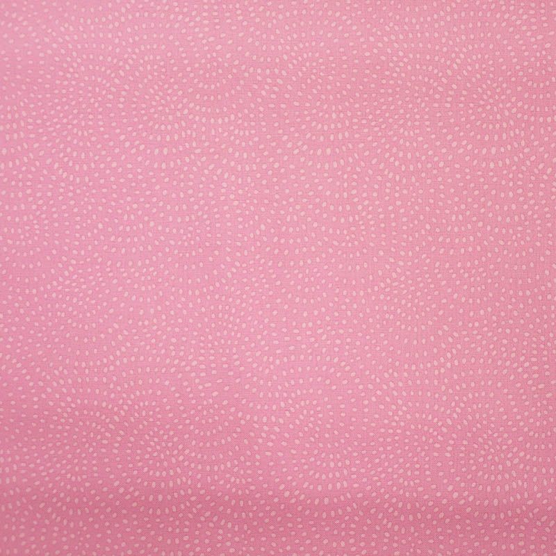 100% Cotton Pink Blender Fabric featuring a subtle print of white spots in a spiral on a pink background.