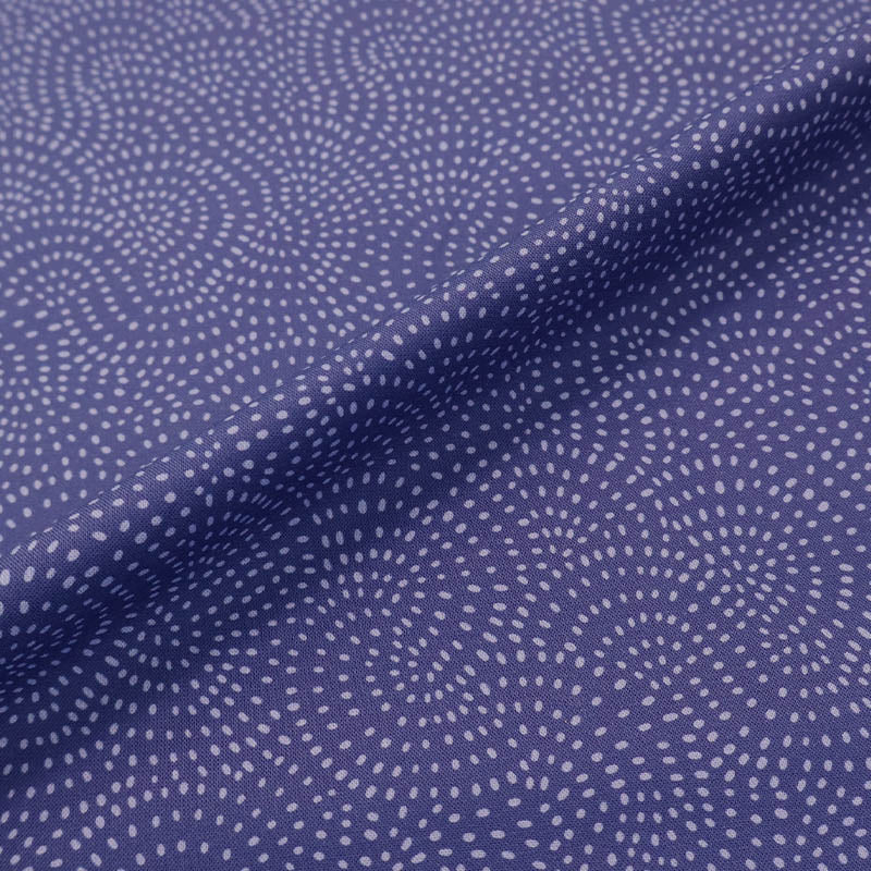 100% Cotton Dark Blue Blender Fabric with a spiral spot pattern in a paler blue