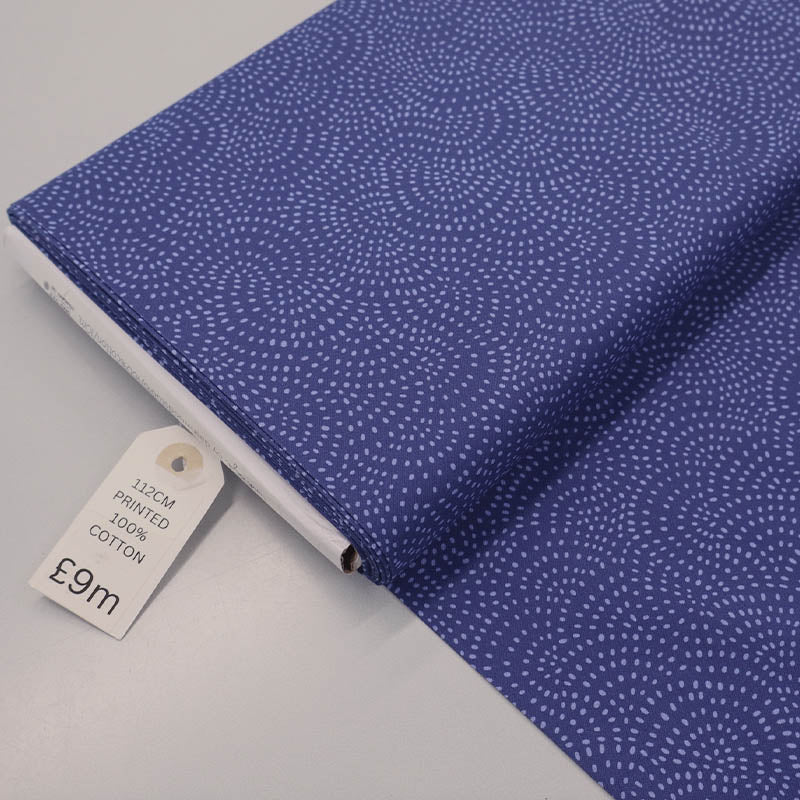 100% Cotton Dark Blue Blender Fabric with a spiral spot pattern