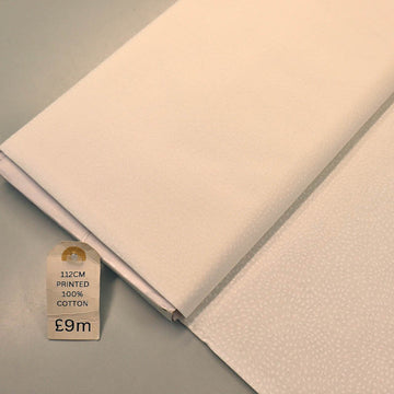 100% Cotton White Blender Fabric with white spots in a spiral design on a white background
