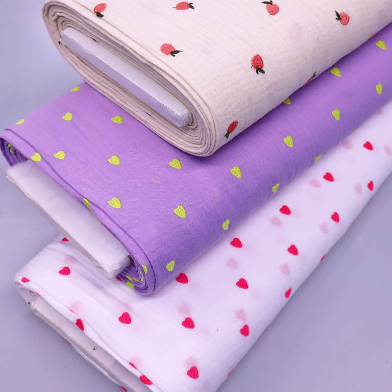 100% Cotton Double Gauze Fabrics with embroidered hearts on white and lilac and orange peaches  on cream