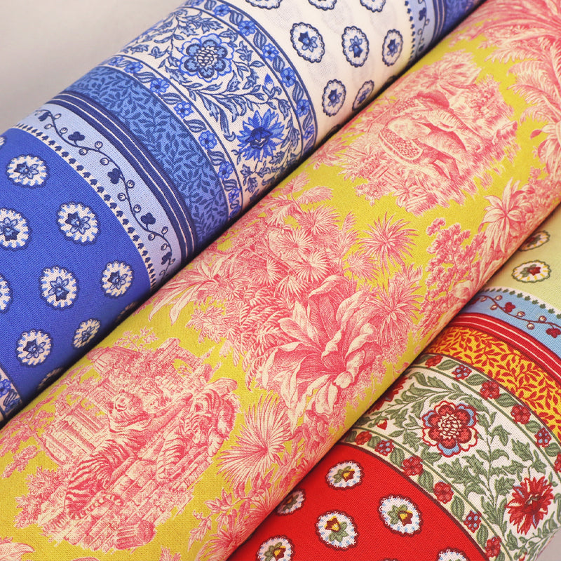 Three rolls of patterned 100% cotton fabric with different designs including floral stripes and jungle prints