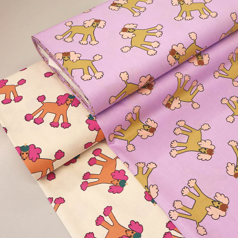 100% Organic Cotton Poplin Fabrics  in Lilac and Cream featuring  a Cartoon Poodle Print