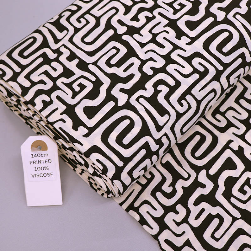 100% Viscose Fabric - Black and Cream Maze Print
