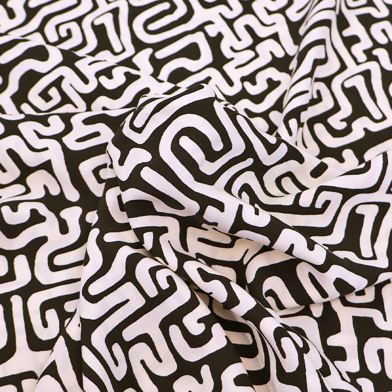 100% Viscose Fabric - Black and Cream Maze Print