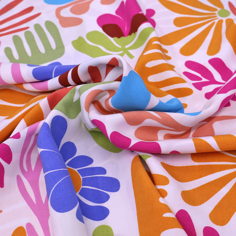 100% Viscose Fabric - Multicoloured Pink, Orange and Blue Modern Floral on a white background