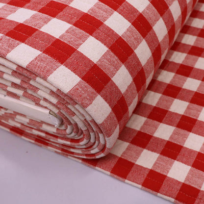 Pre quilted 100% cotton fabric in a red gingham on one side and narrow red and white stripe on the reverse