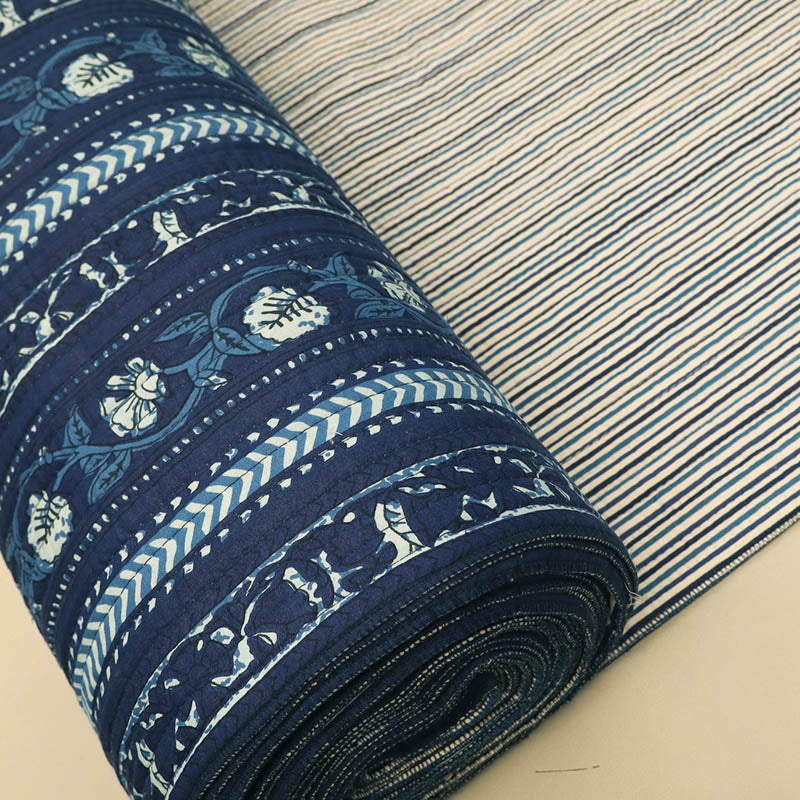 100% Cotton, including Wadding Quilted Indian Cotton Fabric - Indigo Blue Floral and Geometric Border Design with fine stripe on the reverse