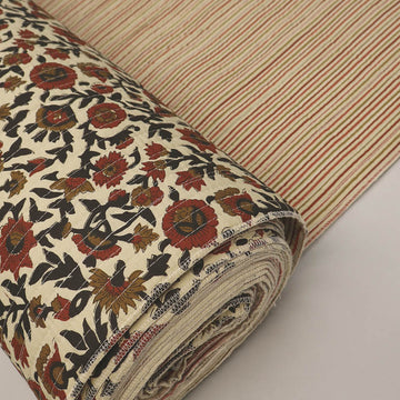 Quilted 100% Indian cotton fabric with a floral design in red, brown and black on a cream background on one side and a fine red and brown stripe on the reverse.