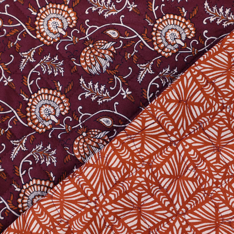 100% Cotton fabrics with Polyester Wadding QUILTED Fabric - Burgundy and Orange Floral with geometric design on the reverse