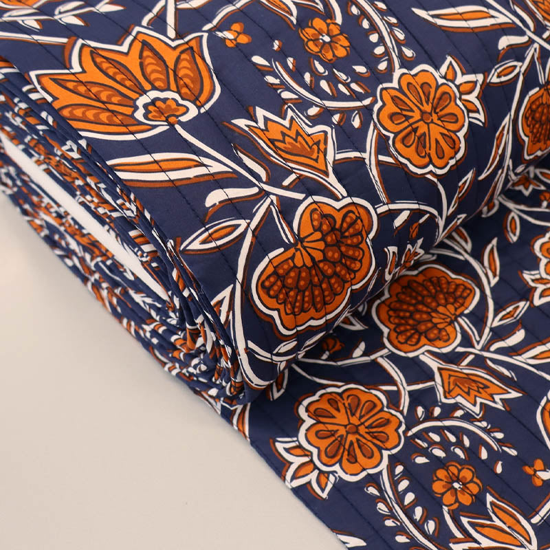 100% Cotton with Polyester Wadding QUILTED Cotton Fabric - Navy and Orange Floral
