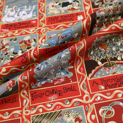 Christmas fabric panel in red featuring images from the 12 days of xmas