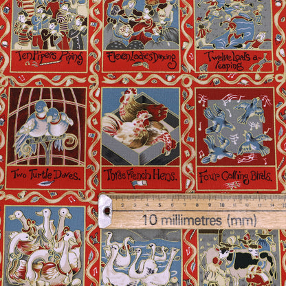 Christmas fabric panel in red featuring images from the 12 days of xmas