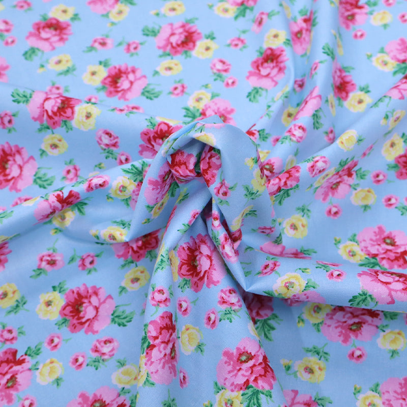 100% Cotton Blue Floral Cotton Fabric with pink and yellow flowers