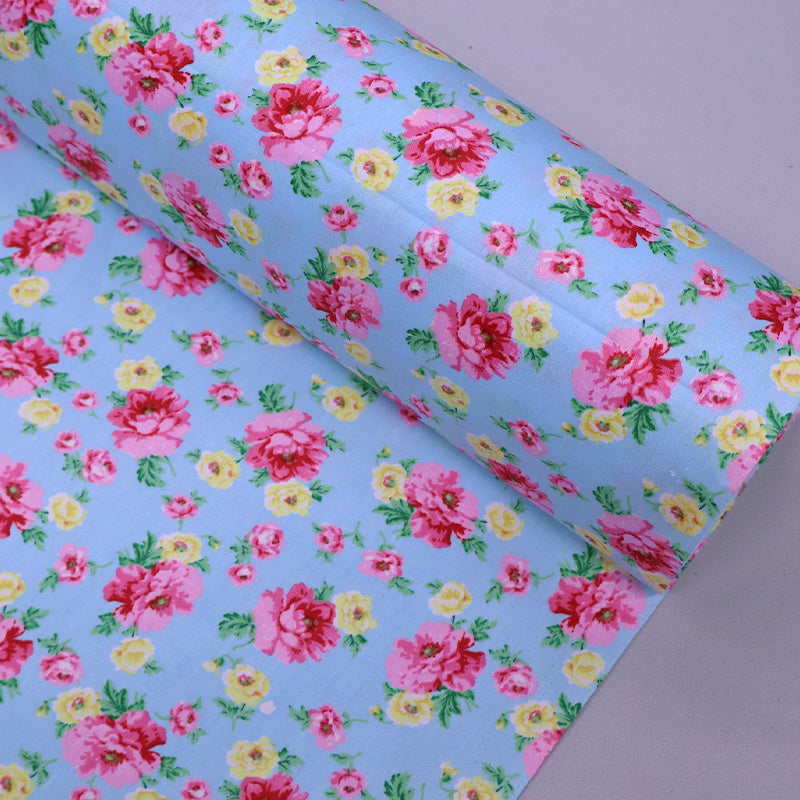 100% Cotton Blue Floral Cotton Fabric with pink and yellow flowers