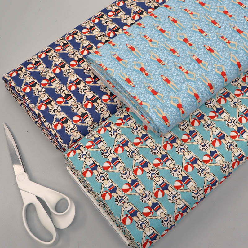 Navy and Pale blue fabrics featuring retro swimming design. 