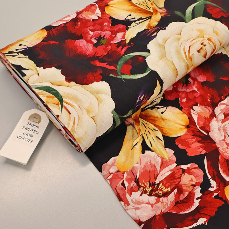 100% Viscose Black and Red Floral Viscose Fabric featuring a bold floral design in red, cream and yellow on a black background.