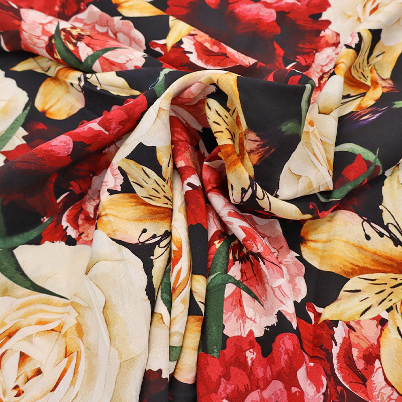 100% Viscose Black and Red Floral Viscose Fabric featuring a bold floral design in red, cream and yellow on a black background.