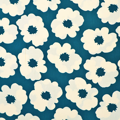 100% Viscose Floral Viscose Fabric featuring a bold modern floral in cream on a petrol blue-green background
