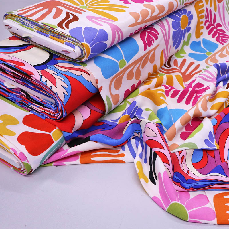 100% Viscose Fabrics - Multicoloured Floral fabrics on a white background