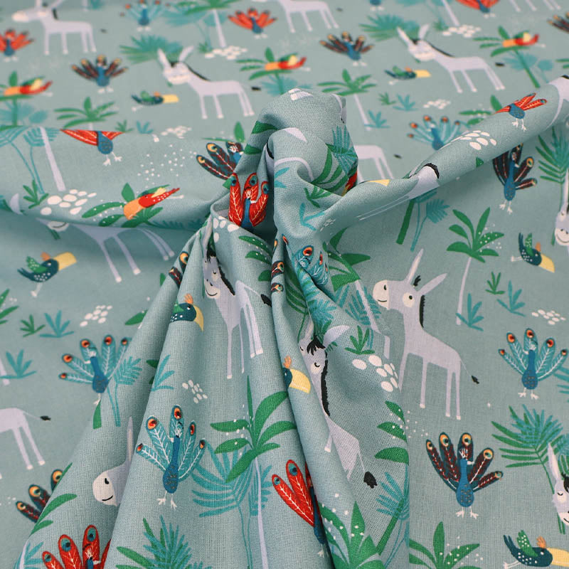 100% Cotton Aqua Blue Novelty Cotton Fabric - Donkey and Peacocks