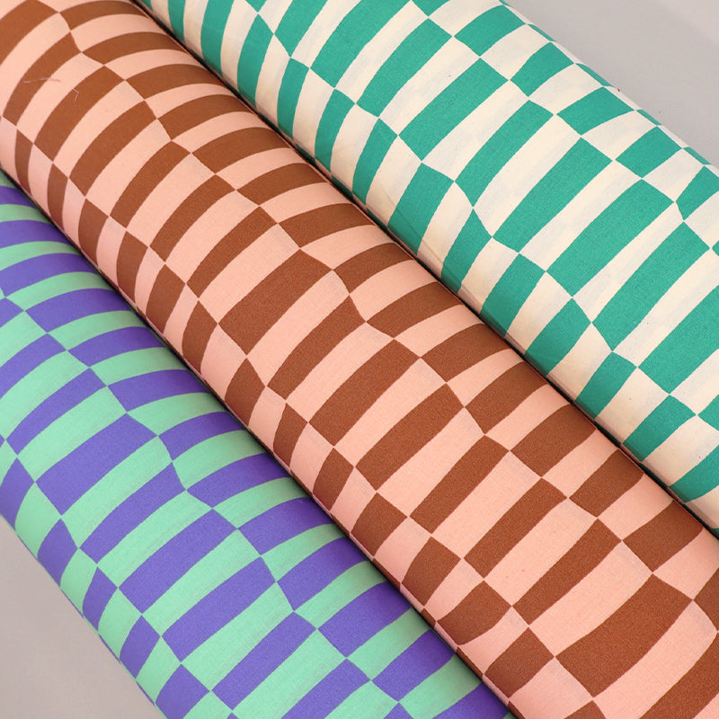 100% Organic Cotton Poplin Fabrics featuring a wavy geometric check pattern in green & Purple, brown and pink and green and cream 