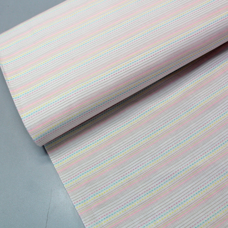 Cream stitch print cotton fabric