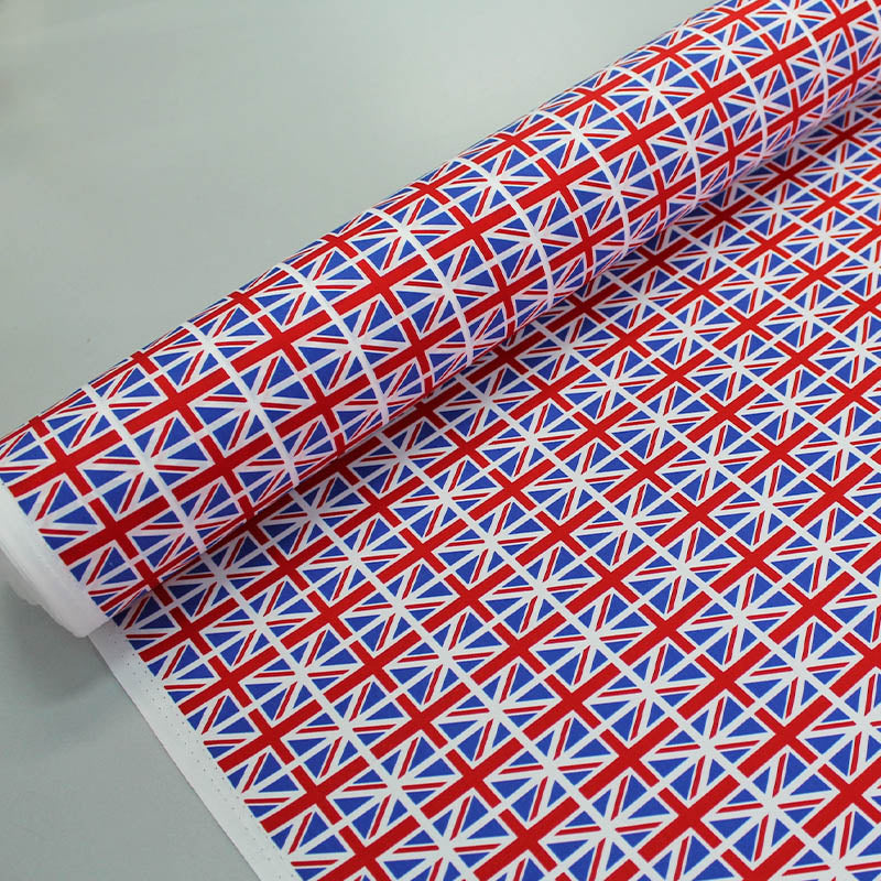 100% Cotton Union Jack Flag Fabric
 in red, white and blue. With the flags in neat rows 
