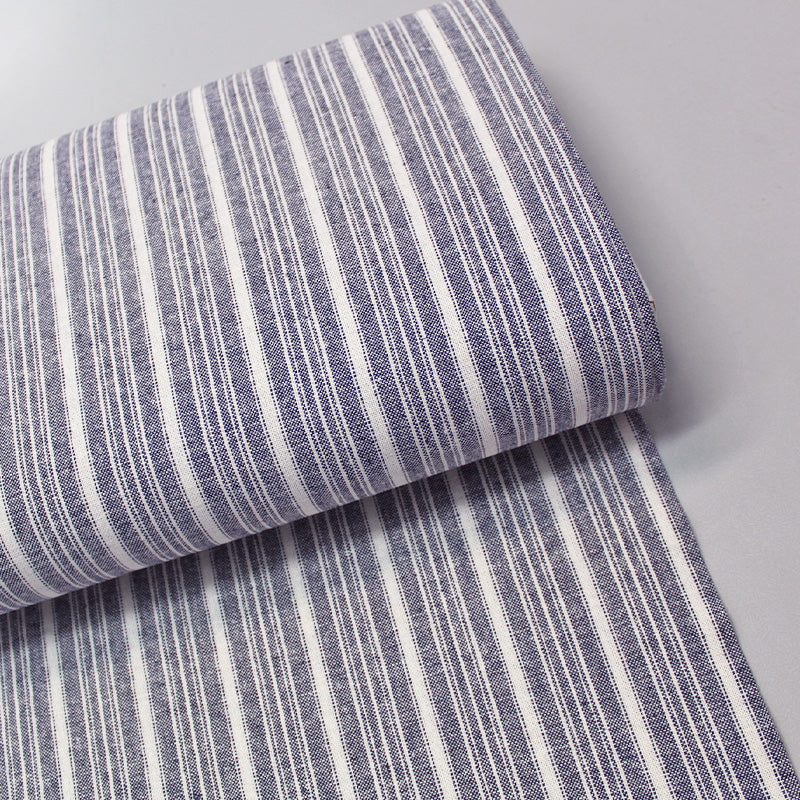 Linen and cotton blend navy and cream striped dressmaking fabric